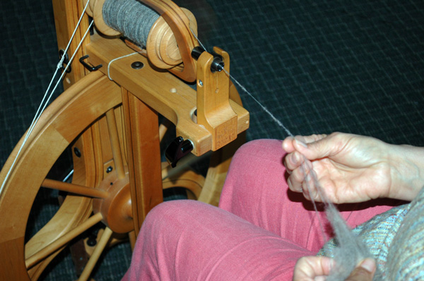 Blue Ridge Spinners and Weavers Guild member demontrating spinning